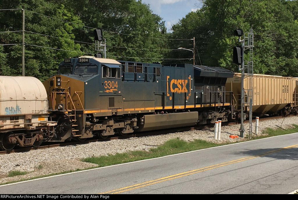 CSX 3304 passes the signals